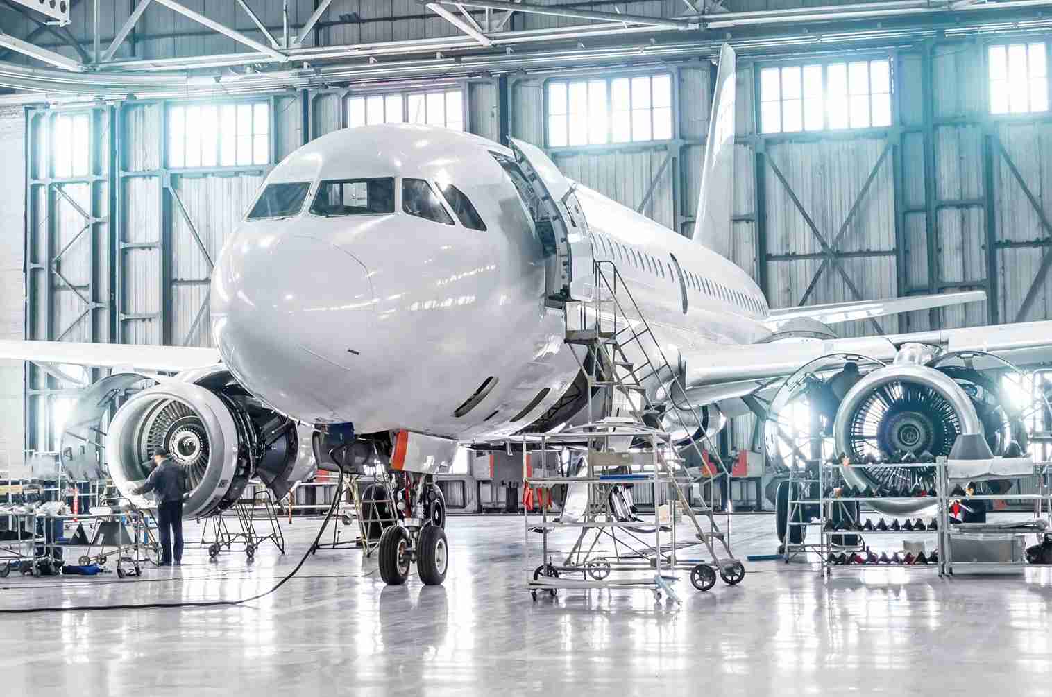commercial jet plane in a hangar